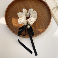 Retro black and white scrunchie with pearl and ribbon bow