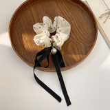 Retro black and white scrunchie with pearl and ribbon bow
