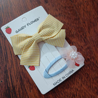 Checks bow and matching tictac clip
