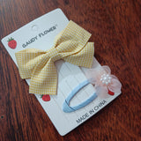 Checks bow and matching tictac clip
