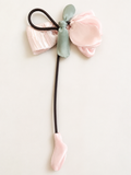 Fascinator tulip on bow with dangling bud