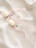 Pair of satin tulip bud fascinator hairclips with ribbon trails