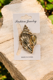 Conch shell medium clutcher