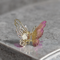 Small enamel butterfly clutcher
