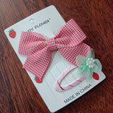 Checks bow and matching tictac clip
