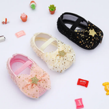 Three Pret my baby Rosette bellies with star in pink feature glittery bows and gold star accents. Displayed on white and surrounded by toy plants and candy, they make the perfect charming infant gift.