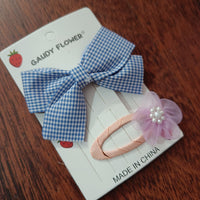 Checks bow and matching tictac clip