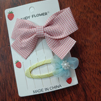 Checks bow and matching tictac clip