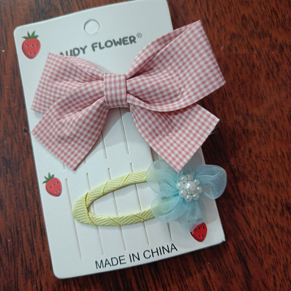 Checks bow and matching tictac clip