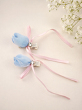 Pair of satin tulip bud fascinator hairclips with ribbon trails