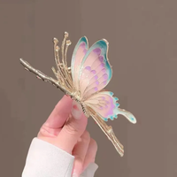 Multi hued flying butterfly metal clutcher