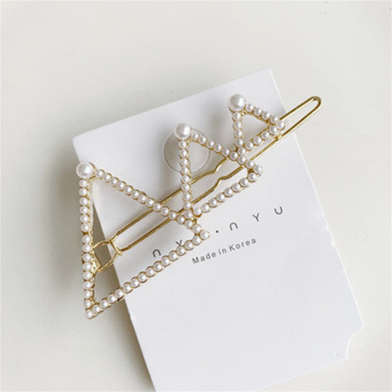 Pearl lined Golden shapes hairclip