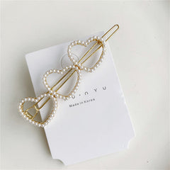 Pearl lined Golden shapes hairclip