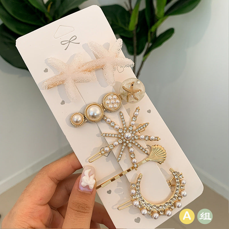 Pack of 5 faux pearl hairclips star